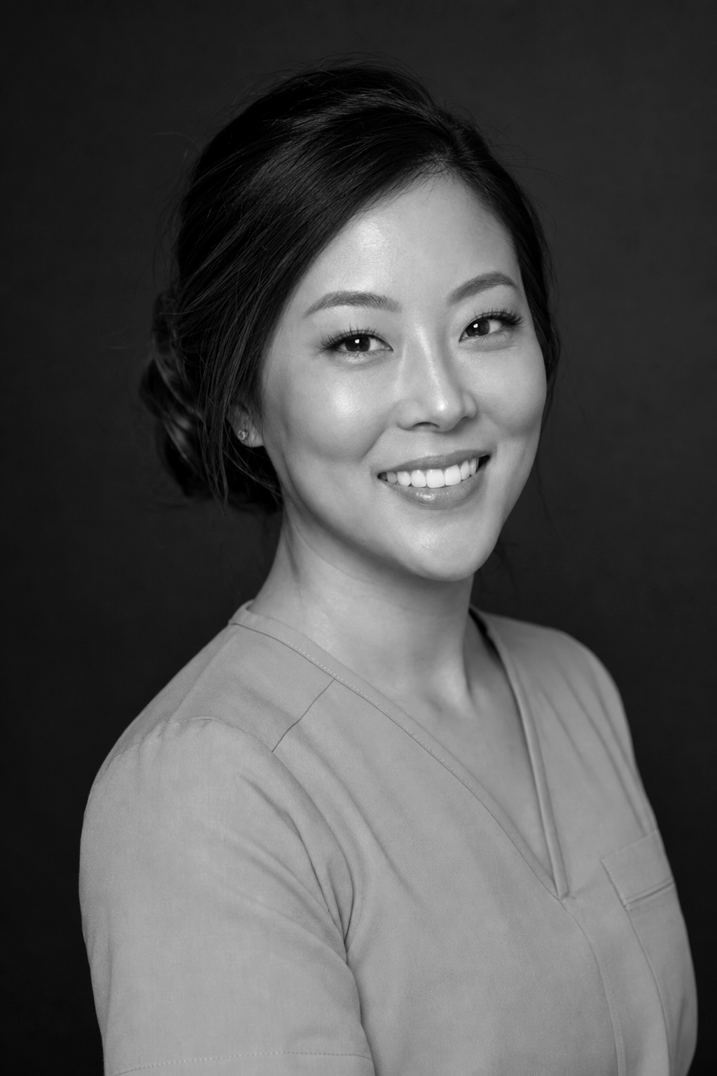 Studio portrait of Naomi Park (AI-generated fictional persona)